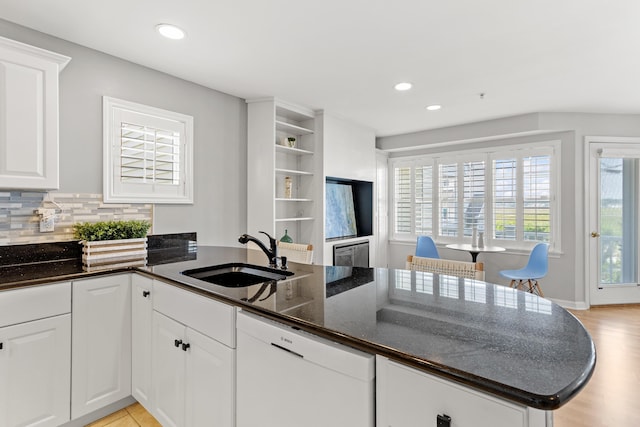 520 Ocean Blvd Unit 10, Hampton, NH 03842 - kitchen featuring white dishwasher, open shelves, a peninsula, white cabinetry, and dark stone counters