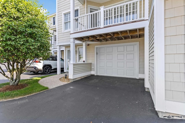 520 Ocean Blvd Unit 10, Hampton, NH 03842 - view of side of home featuring an attached garage, a balcony, and driveway