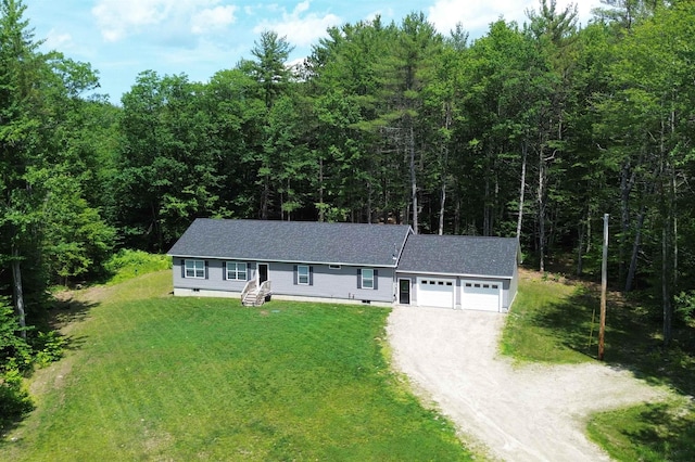 23 Pork Hill Rd, Ossipee, NH 03864 - ranch-style home with driveway, an attached garage, a view of trees, and crawl space