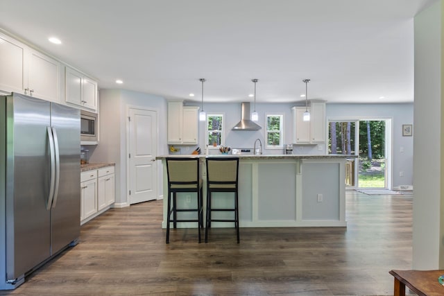 23 Pork Hill Rd, Ossipee, NH 03864 - kitchen featuring appliances with stainless steel finishes, wall chimney exhaust hood, white cabinetry, recessed lighting, and dark wood finished floors