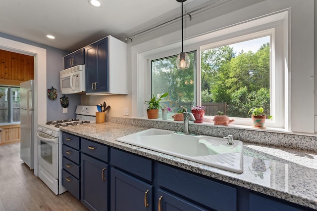 21 Redington Rd, Concord, NH 03301 - kitchen with white appliances, blue cabinets, pendant lighting, light wood-style floors, and recessed lighting