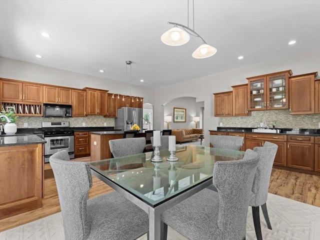 1 Dragonfly Way, Londonderry, NH 03053 - dining space with arched walkways, light wood finished floors, and recessed lighting