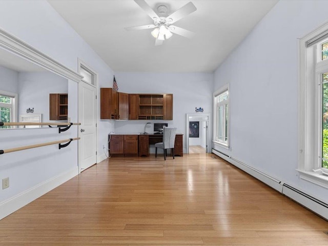 1 Dragonfly Way, Londonderry, NH 03053 - kitchen with a baseboard heating unit, light wood-type flooring, and healthy amount of natural light