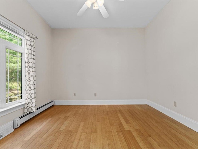 1 Dragonfly Way, Londonderry, NH 03053 - spare room with a baseboard heating unit, light wood-style flooring, and ceiling fan