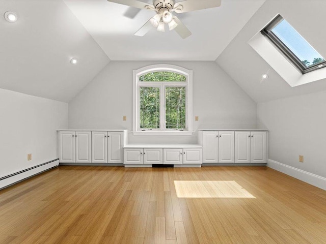 1 Dragonfly Way, Londonderry, NH 03053 - additional living space featuring a skylight, light wood-style floors, vaulted ceiling, ceiling fan, and recessed lighting