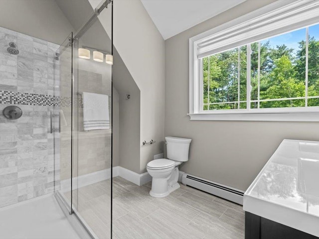 1 Dragonfly Way, Londonderry, NH 03053 - bathroom featuring a baseboard heating unit, plenty of natural light, a stall shower, vanity, and vaulted ceiling