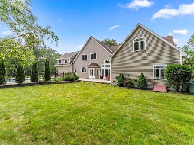 1 Dragonfly Way, Londonderry, NH 03053 - rear view of property with a patio area