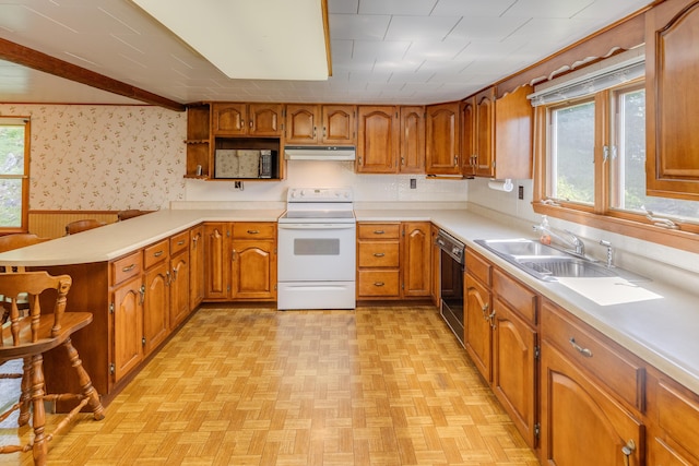 141 Manns Hill Rd, Littleton, NH 03561 - kitchen featuring white electric range, under cabinet range hood, open shelves, dishwasher, and brown cabinetry