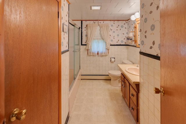 141 Manns Hill Rd, Littleton, NH 03561 - bathroom featuring baseboard heating, vanity, tile patterned floors, and wallpapered walls