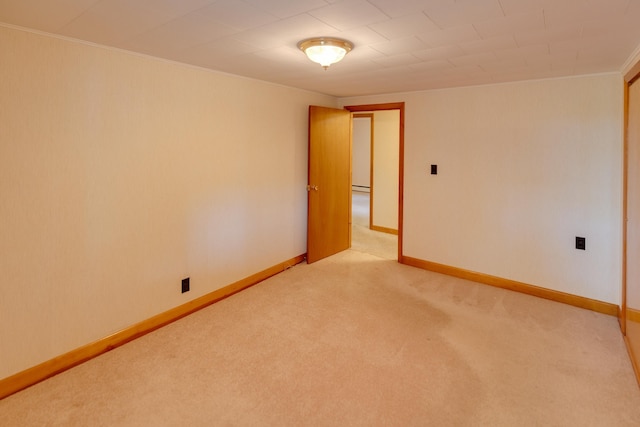 141 Manns Hill Rd, Littleton, NH 03561 - unfurnished room featuring light colored carpet, ornamental molding, and a baseboard heating unit