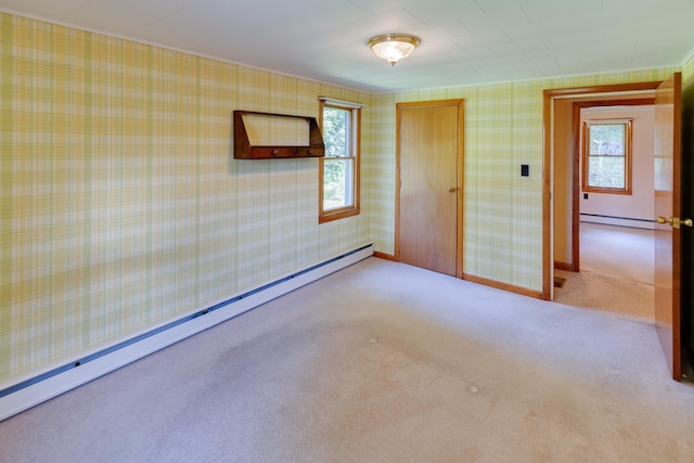 141 Manns Hill Rd, Littleton, NH 03561 - carpeted spare room with a baseboard heating unit, a baseboard radiator, healthy amount of natural light, and wallpapered walls