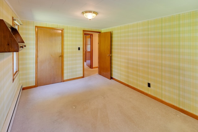 141 Manns Hill Rd, Littleton, NH 03561 - unfurnished room featuring a baseboard radiator, light colored carpet, and wallpapered walls