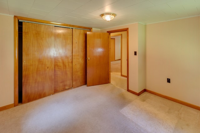 141 Manns Hill Rd, Littleton, NH 03561 - unfurnished bedroom featuring a closet, ornamental molding, and carpet flooring