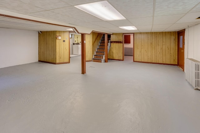 141 Manns Hill Rd, Littleton, NH 03561 - finished below grade area featuring radiator heating unit, washer / dryer, stairs, wood walls, and a paneled ceiling