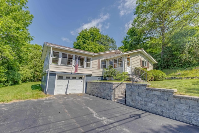 141 Manns Hill Rd, Littleton, NH 03561 - view of front of home with a garage, driveway, and a front yard