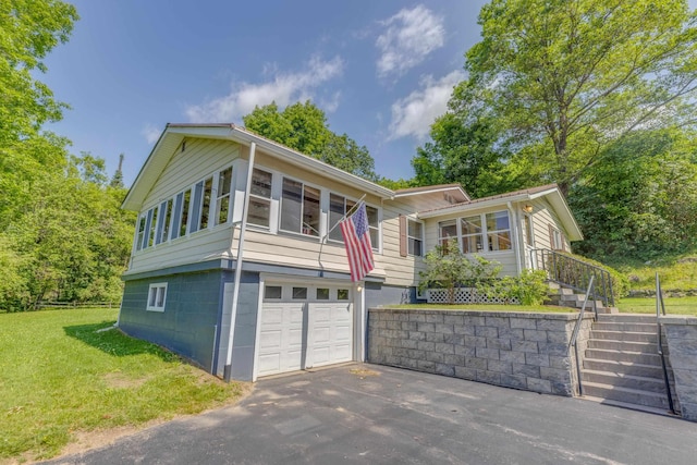 141 Manns Hill Rd, Littleton, NH 03561 - view of front facade featuring an attached garage, stairs, a front yard, and driveway