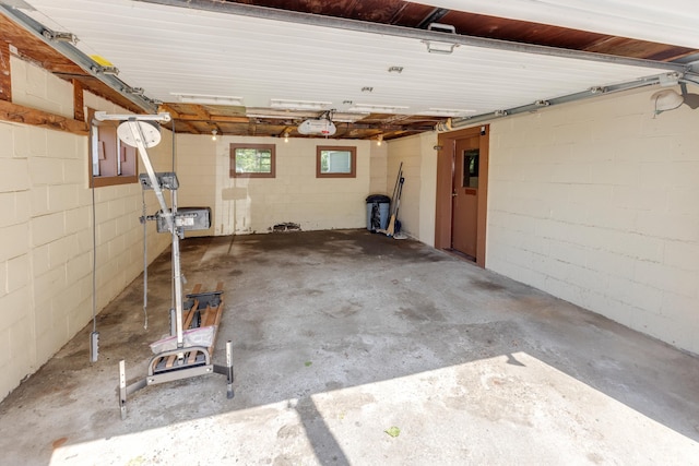 141 Manns Hill Rd, Littleton, NH 03561 - garage with a garage door opener and concrete block wall