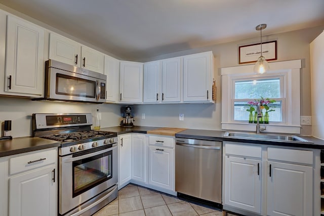 15 Arbor St # 1, Exeter, NH 03833 - kitchen featuring appliances with stainless steel finishes, dark countertops, and white cabinets