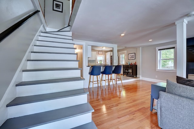 15 Arbor St # 1, Exeter, NH 03833 - stairway featuring wood finished floors, recessed lighting, and decorative columns