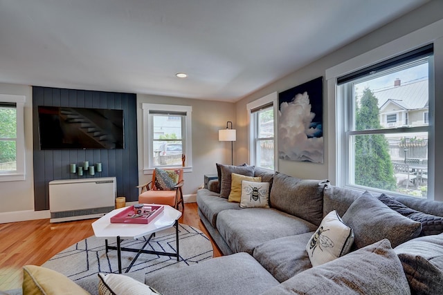15 Arbor St # 1, Exeter, NH 03833 - living area featuring plenty of natural light, light wood finished floors, heating unit, and recessed lighting