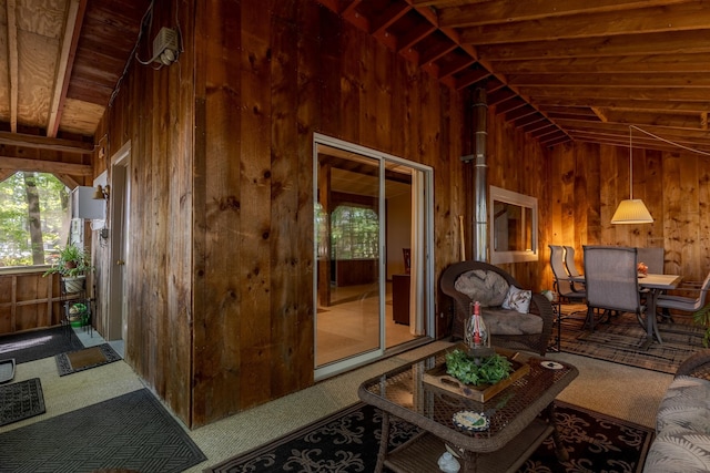396 Mica Point Rd, Barrington, NH 03825 - carpeted living room with wood walls, lofted ceiling, and wood ceiling