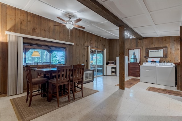 396 Mica Point Rd, Barrington, NH 03825 - dining area featuring wood walls, independent washer and dryer, a ceiling fan, light flooring, and a wall mounted air conditioner