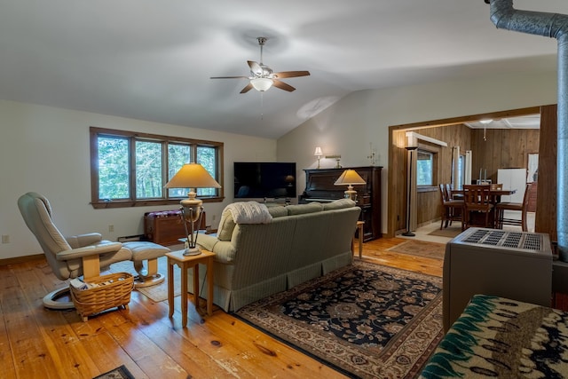 396 Mica Point Rd, Barrington, NH 03825 - living area featuring a ceiling fan, light wood-style flooring, lofted ceiling, and a baseboard heating unit