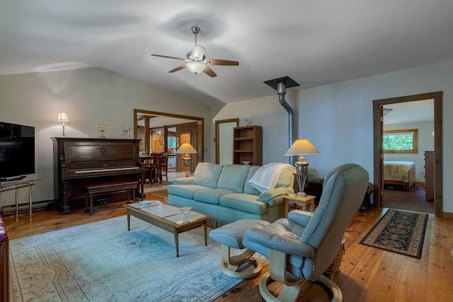 396 Mica Point Rd, Barrington, NH 03825 - living room with ceiling fan, hardwood / wood-style floors, vaulted ceiling, and a baseboard heating unit