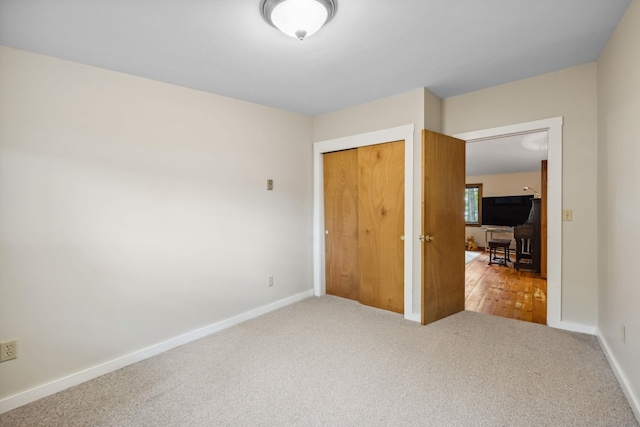 396 Mica Point Rd, Barrington, NH 03825 - unfurnished bedroom with a closet and carpet flooring