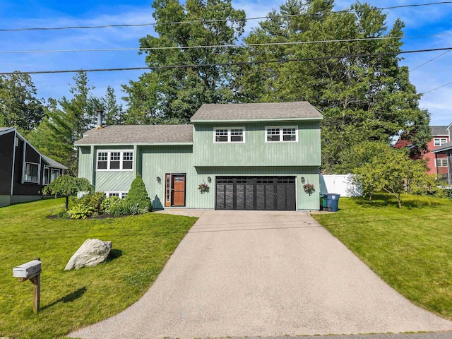20 Cimmarron Dr, Nashua, NH 03062 - view of front of home featuring a garage, concrete driveway, and roof with shingles