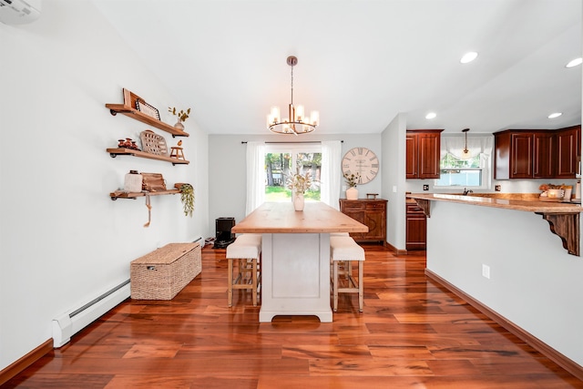 20 Cimmarron Dr, Nashua, NH 03062 - dining space featuring a baseboard radiator, a chandelier, plenty of natural light, dark wood-style floors, and recessed lighting