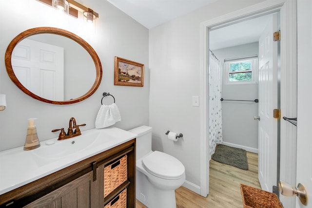 20 Cimmarron Dr, Nashua, NH 03062 - bathroom with wood finished floors and vanity