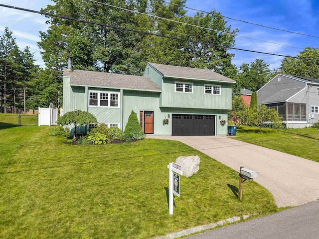 20 Cimmarron Dr, Nashua, NH 03062 - view of front of house with a garage, driveway, and a shingled roof