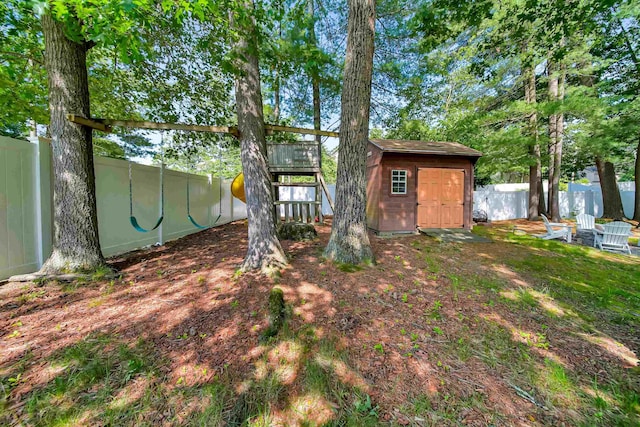 20 Cimmarron Dr, Nashua, NH 03062 - rear view of house with a storage unit and a fenced backyard