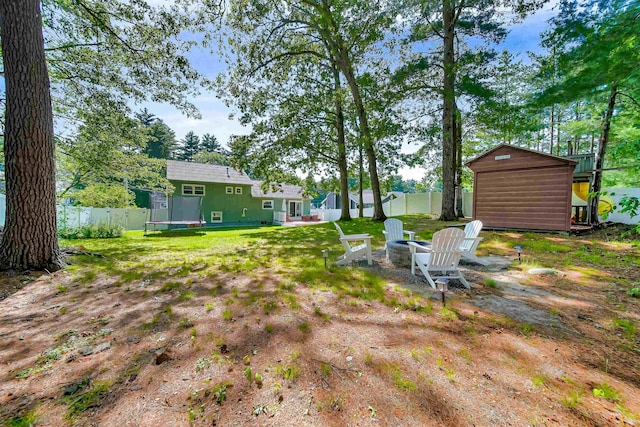 20 Cimmarron Dr, Nashua, NH 03062 - fenced backyard with a shed and a fire pit