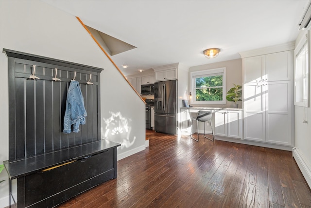 38 Heald St, Goffstown, NH 03102 - unfurnished living room with dark wood finished floors and baseboard heating