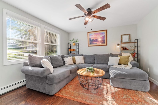 38 Heald St, Goffstown, NH 03102 - living area featuring baseboard heating, healthy amount of natural light, wood finished floors, and ceiling fan