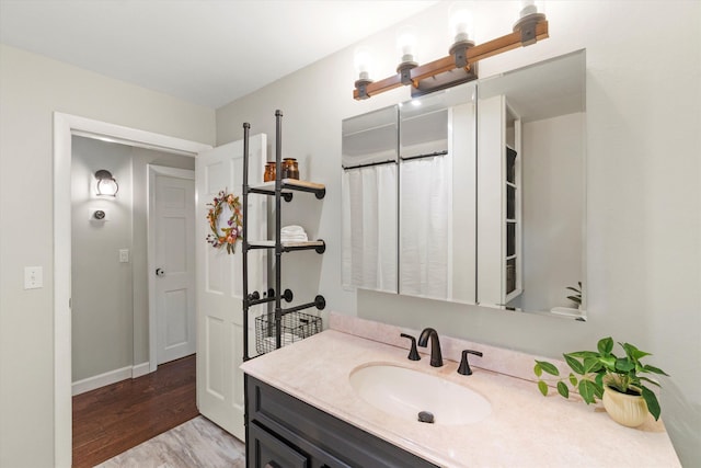 38 Heald St, Goffstown, NH 03102 - bathroom with wood finished floors and vanity