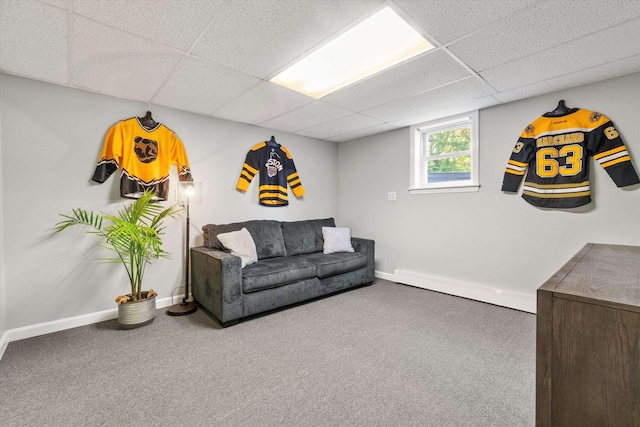 38 Heald St, Goffstown, NH 03102 - living room with a baseboard heating unit, a paneled ceiling, and carpet floors