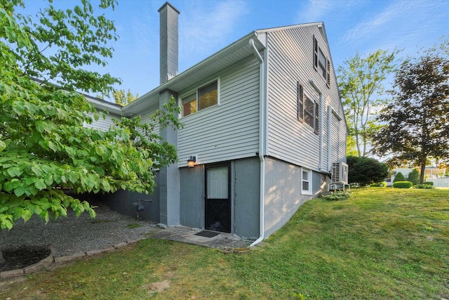 38 Heald St, Goffstown, NH 03102 - rear view of property with a chimney and a lawn