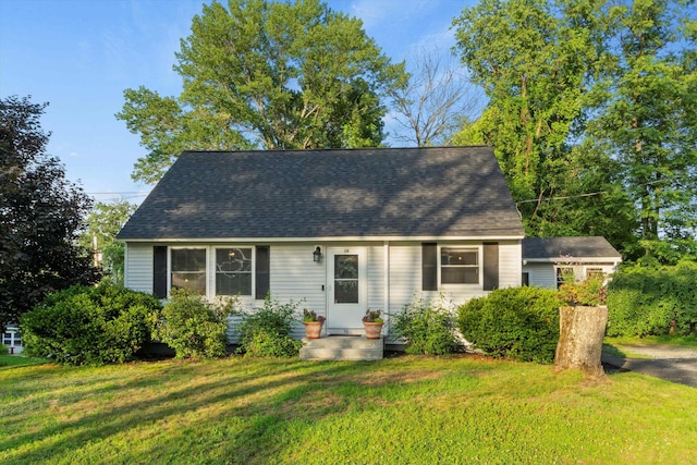 38 Heald St, Goffstown, NH 03102 - cape cod-style house featuring a front lawn and a shingled roof