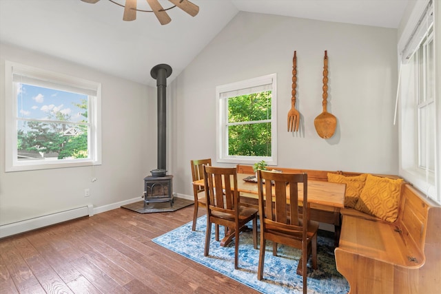 38 Heald St, Goffstown, NH 03102 - dining area featuring a wood stove, plenty of natural light, wood finished floors, lofted ceiling, and a ceiling fan