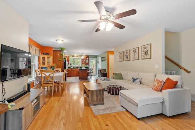 317 Old Concord Tpke Unit 1, Barrington, NH 03825 - living room featuring light wood-style floors and ceiling fan