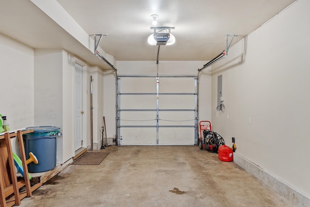 317 Old Concord Tpke Unit 1, Barrington, NH 03825 - garage featuring a garage door opener and electric panel