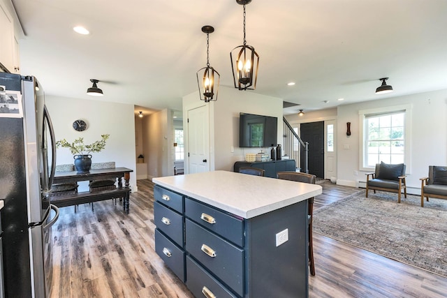 39 Windy Fields Ln, Jaffrey, NH 03452 - kitchen with freestanding refrigerator, a center island, blue cabinetry, light wood-type flooring, and recessed lighting