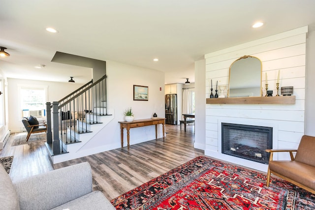 39 Windy Fields Ln, Jaffrey, NH 03452 - living room featuring wood finished floors, stairs, a large fireplace, and recessed lighting