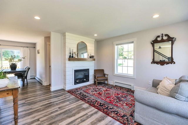 39 Windy Fields Ln, Jaffrey, NH 03452 - living area featuring baseboard heating, wood finished floors, recessed lighting, and a large fireplace
