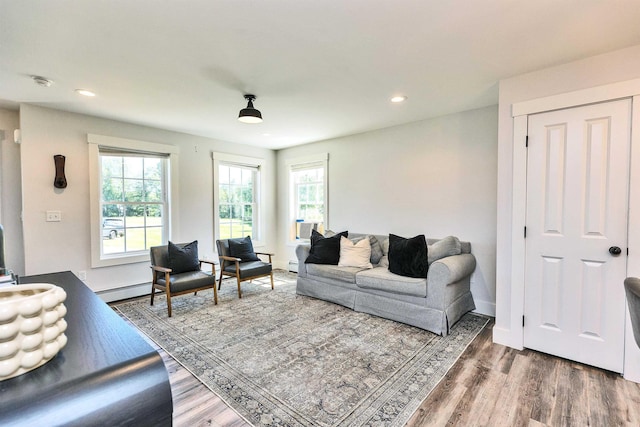 39 Windy Fields Ln, Jaffrey, NH 03452 - living area featuring baseboard heating, wood finished floors, recessed lighting, and a baseboard radiator