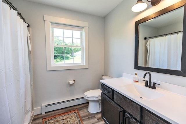 39 Windy Fields Ln, Jaffrey, NH 03452 - bathroom with baseboard heating, vanity, wood finished floors, and curtained shower
