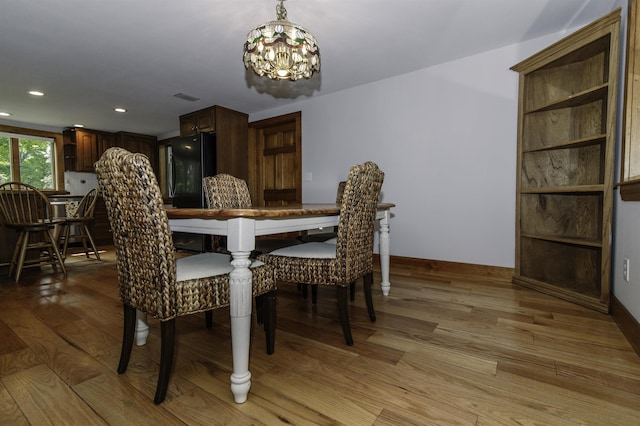 153 N Rd, Brentwood, NH 03833 - dining space featuring light wood-style floors, a chandelier, and recessed lighting